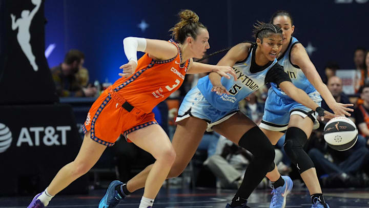Jun 15, 2025; Uncasville, Connecticut, USA; Chicago Sky forward Angel Reese (5) and Connecticut Sun guard Marina Mabrey (3) work for the ball in the first half at Mohegan Sun Arena. Mandatory Credit: David Butler II-Imagn Images