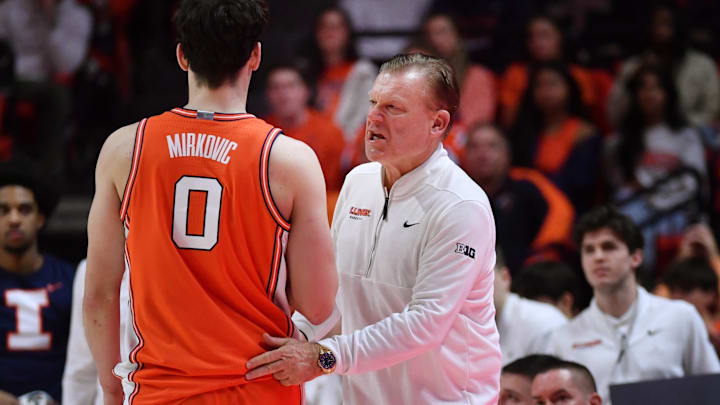 Feb 4, 2026; Champaign, Illinois, USA;  Illinois Fighting Illini head coach Brad Underwood talks to forward David Mirkovic (0) during the first half against the Northwestern Wildcats at State Farm Center. Mandatory Credit: Ron Johnson-Imagn Images