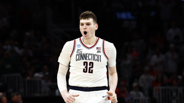 Mar 30, 2024; Boston, MA, USA; Connecticut Huskies center Donovan Clingan (32) reacts against the