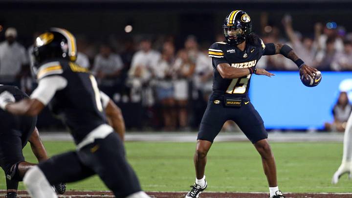 Sep 26, 2026; Starkville, Mississippi, USA; Missouri Tigers quarterback Austin Simmons (13) passes the ball during the second quarter against the Mississippi State Bulldogs at Davis Wade Stadium at Scott Field. Mandatory Credit: Petre Thomas-Imagn Images