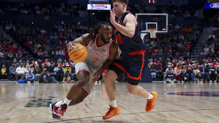 Feb 14, 2026; Nashville, Tennessee, USA; Ohio State Buckeyes guard Bruce Thornton (2) drives to the basket past Virginia Cavaliers guard Dallin Hall (30) during the first half at Bridgestone Arena. Mandatory Credit: Steve Roberts-Imagn Images Feb 14, 2026; Nashville, Tennessee, USA; Ohio State Buckeyes guard Bruce Thornton (2) drives to the basket past Virginia Cavaliers guard Dallin Hall (30) during the first half at Bridgestone Arena. Mandatory Credit: Steve Roberts-Imagn Images