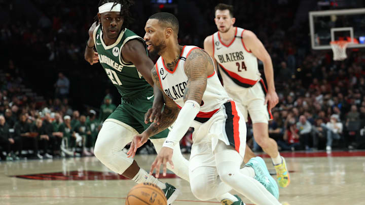 Feb 6, 2023; Portland, Oregon, USA; Portland Trail Blazers guard Damian Lillard (0) drives the lane against Milwaukee Bucks guard Jrue Holiday (21) in the second half at Moda Center. Mandatory Credit: Jaime Valdez-Imagn Images