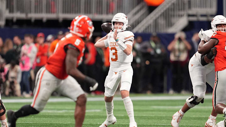 Dec 7, 2024; Atlanta, GA, USA; Texas Longhorns quarterback Quinn Ewers (3) drops back to pass against the Georgia Bulldogs during the first half in the 2024 SEC Championship game at Mercedes-Benz Stadium. Mandatory Credit: Dale Zanine-Imagn Images