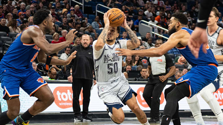 Dec 15, 2024; Orlando, Florida, USA; Orlando Magic guard Cole Anthony (50) drives to the basket against New York Knicks forward OG Anunoby (8) in the fourth quarter at Kia Center. Mandatory Credit: Jeremy Reper-Imagn Images Dec 15, 2024; Orlando, Florida, USA; Orlando Magic guard Cole Anthony (50) drives to the basket against New York Knicks forward OG Anunoby (8) in the fourth quarter at Kia Center. Mandatory Credit: Jeremy Reper-Imagn Images