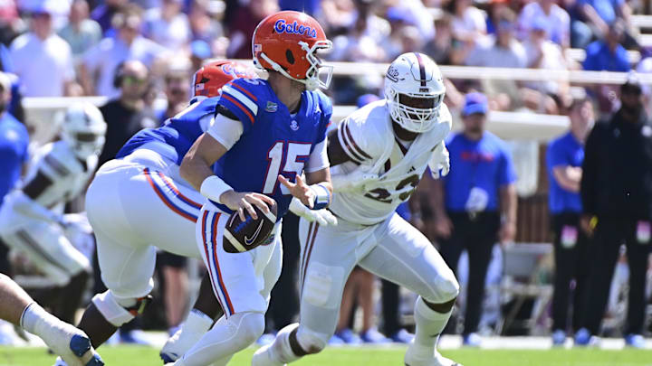 Sep 21, 2024; Starkville, Mississippi, USA; Florida Gators quarterback Graham Mertz (15) rolls out to pass against the Mississippi State Bulldogs during the third quarter at Davis Wade Stadium at Scott Field. Mandatory Credit: Matt Bush-Imagn Images
