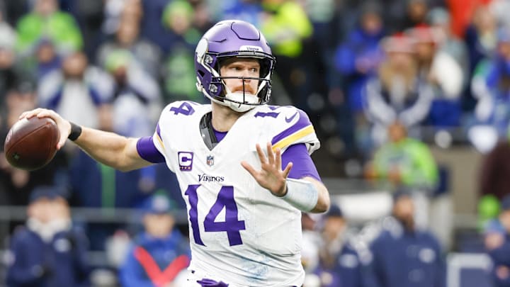 Dec 22, 2024; Seattle, Washington, USA; Minnesota Vikings quarterback Sam Darnold (14) passes against the Seattle Seahawks during the third quarter at Lumen Field. Mandatory Credit: Joe Nicholson-Imagn Images