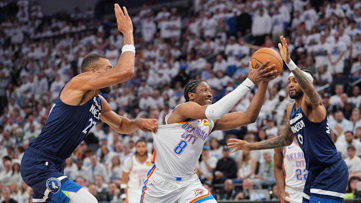 May 24, 2025; Minneapolis, Minnesota, USA; Oklahoma City Thunder forward Jalen Williams (8) dribbles the ball past Minnesota Timberwolves center Rudy Gobert (27) during the first half in game three of the western conference finals for the 2025 NBA Playoffs at Target Center. Mandatory Credit: Brad Rempel-Imagn Images