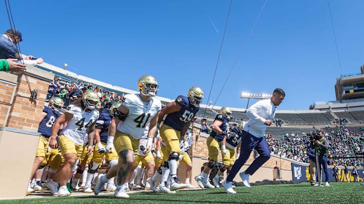 Apr 12, 2025; Notre Dame, IN, USA; Notre Dame Fighting Irish head coach Marcus Freeman leads the team onto the field during the Blue-Gold game at Notre Dame Stadium. Mandatory Credit: Michael Caterina-Imagn Images Apr 12, 2025; Notre Dame, IN, USA; Notre Dame Fighting Irish head coach Marcus Freeman leads the team onto the field during the Blue-Gold game at Notre Dame Stadium. Mandatory Credit: Michael Caterina-Imagn Images