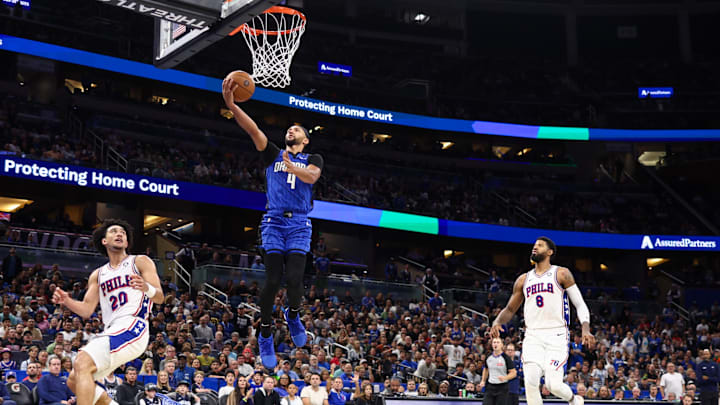Orlando Magic guard Jalen Suggs (4) drives to the basket against the Philadelphia 76ers in the fourth quarter at Kia Center.