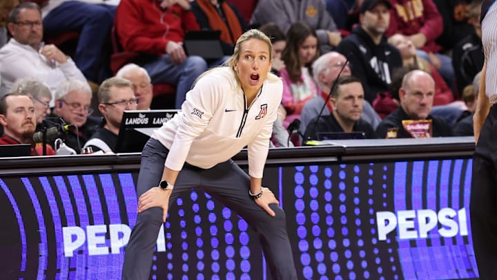 Jan 24, 2026; Ames, Iowa, USA; Arizona Wildcats head coach Becky Burke watches her team play the Iowa State Cyclones during the first half at James H. Hilton Coliseum. Mandatory Credit: Reese Strickland-Imagn Images Jan 24, 2026; Ames, Iowa, USA; Arizona Wildcats head coach Becky Burke watches her team play the Iowa State Cyclones during the first half at James H. Hilton Coliseum. Mandatory Credit: Reese Strickland-Imagn Images