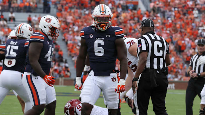 Sep 28, 2024; Auburn, Alabama, USA;  Auburn Tigers linebacker Austin Keys (6) reacts after tackling Oklahoma Sooners quarterback Michael Hawkins Jr. (9) during the first quarter at Jordan-Hare Stadium.
