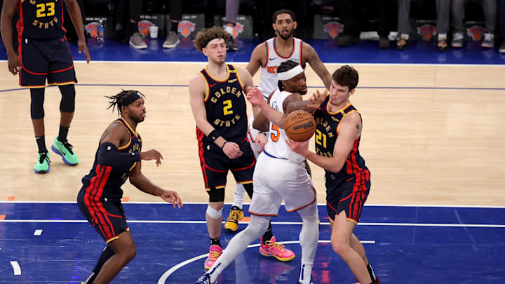 Mar 4, 2025; New York, New York, USA; New York Knicks forward Precious Achiuwa (5) and guard Cameron Payne (1) fight for a rebound against Golden State Warriors center Quinten Post (21) and guards Brandin Podziemski (2) and Buddy Hield (7) during the fourth quarter at Madison Square Garden. Mandatory Credit: Brad Penner-Imagn Images Mar 4, 2025; New York, New York, USA; New York Knicks forward Precious Achiuwa (5) and guard Cameron Payne (1) fight for a rebound against Golden State Warriors center Quinten Post (21) and guards Brandin Podziemski (2) and Buddy Hield (7) during the fourth quarter at Madison Square Garden. Mandatory Credit: Brad Penner-Imagn Images