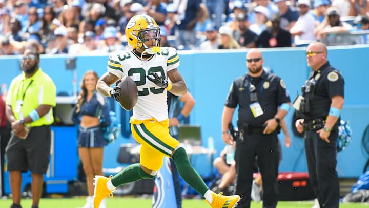 Sep 22, 2024; Nashville, Tennessee, USA;  Green Bay Packers cornerback Jaire Alexander (23) scores on a pick six thrown by Tennessee Titans Will Levis (8) during the first half at Nissan Stadium. Mandatory Credit: Steve Roberts-Imagn Images