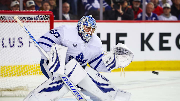 Feb 2, 2026; Calgary, Alberta, CAN; Toronto Maple Leafs goaltender Joseph Woll (60) makes a save against the Calgary Flames during the second period at Scotiabank Saddledome. Mandatory Credit: Sergei Belski-Imagn Images