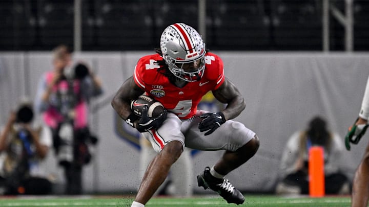 Dec 31, 2025; Arlington, TX, USA; Ohio State Buckeyes wide receiver Jeremiah Smith (4) runs with the ball during the 2025 Cotton Bowl and quarterfinal game of the College Football Playoff at AT&T Stadium. Mandatory Credit: Jerome Miron-Imagn Images