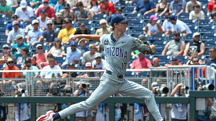 Jun 13, 2025; Omaha, Neb, USA; Arizona Wildcats starting pitcher Owen Kramkowski (17) throws against the Coastal Carolina Chanticleers during the first inning at Charles Schwab Field. Mandatory Credit: Steven Branscombe-Imagn Images