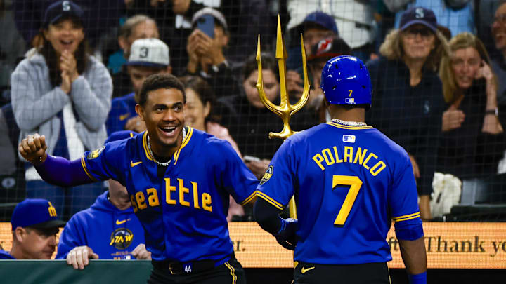 Seattle Mariners center fielder Julio Rodriguez (44) celebrates a solo-home run by second baseman Jorge Polanco (7) against the New York Yankees during the second inning at T-Mobile Park in 2024.