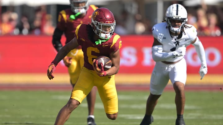 Oct 12, 2024; Los Angeles, California, USA; USC Trojans wide receiver Makai Lemon (6) carries the ball for a first down in the second half against the Penn State Nittany Lions at United Airlines Field at the Los Angeles Memorial Coliseum. Mandatory Credit: Jayne Kamin-Oncea-Imagn Images Oct 12, 2024; Los Angeles, California, USA; USC Trojans wide receiver Makai Lemon (6) carries the ball for a first down in the second half against the Penn State Nittany Lions at United Airlines Field at the Los Angeles Memorial Coliseum. Mandatory Credit: Jayne Kamin-Oncea-Imagn Images