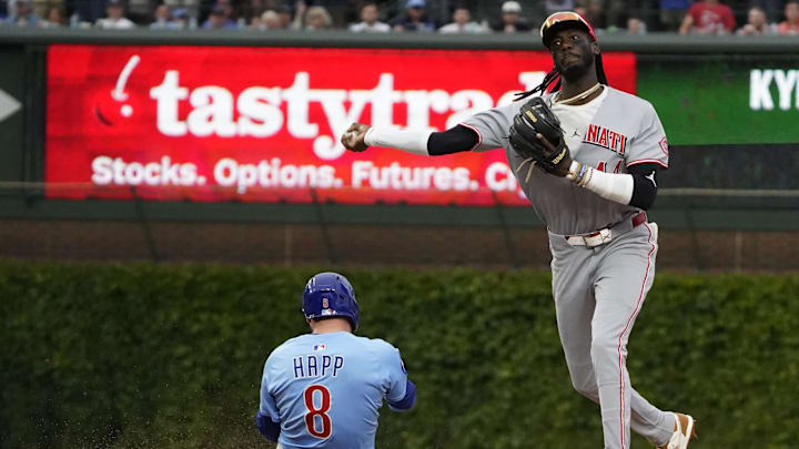 May 30, 2025; Chicago, Illinois, USA; Cincinnati Reds shortstop Elly De La Cruz (44) forces out Chicago Cubs outfielder Ian Happ (8) at second base then throws to first base to complete a double play during the eighth inning at Wrigley Field. Mandatory Credit: David Banks-Imagn Images May 30, 2025; Chicago, Illinois, USA; Cincinnati Reds shortstop Elly De La Cruz (44) forces out Chicago Cubs outfielder Ian Happ (8) at second base then throws to first base to complete a double play during the eighth inning at Wrigley Field. Mandatory Credit: David Banks-Imagn Images