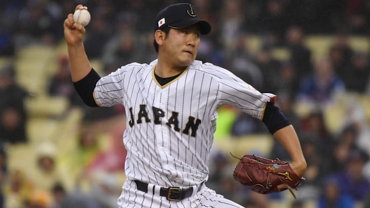 Mar 21, 2017; Los Angeles, CA, USA; Japan pitcher Tomoyuki Sugano (11) throws a pitch during the first inning against United States during the 2017 World Baseball Classic at Dodger Stadium. Mandatory Credit: Robert Hanashiro-Imagn Images