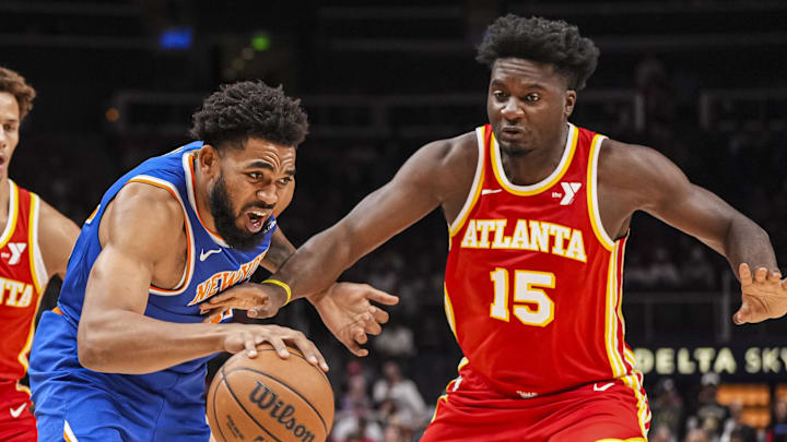 Nov 6, 2024; Atlanta, Georgia, USA; New York Knicks center Karl-Anthony Towns (32) dribbles Atlanta Hawks center Clint Capela (15) during the first half at State Farm Arena. Mandatory Credit: Dale Zanine-Imagn Images Nov 6, 2024; Atlanta, Georgia, USA; New York Knicks center Karl-Anthony Towns (32) dribbles Atlanta Hawks center Clint Capela (15) during the first half at State Farm Arena. Mandatory Credit: Dale Zanine-Imagn Images