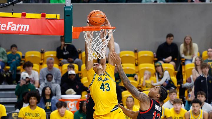 Mar 7, 2026; Waco, Texas, USA; Baylor Bears guard Cameron Carr (43) dunks the ball against Utah Utes forward Kendyl Sanders (13) during the second half at Paul and Alejandra Foster Pavilion. Mandatory Credit: Chris Jones-Imagn Images Mar 7, 2026; Waco, Texas, USA; Baylor Bears guard Cameron Carr (43) dunks the ball against Utah Utes forward Kendyl Sanders (13) during the second half at Paul and Alejandra Foster Pavilion. Mandatory Credit: Chris Jones-Imagn Images