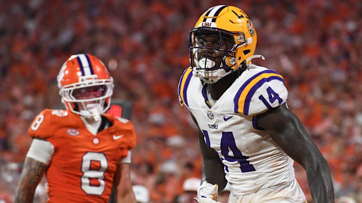 LSU Tigers tight end Trey'Dez Green (14) catches a pass for a touchdown while being defended by Clemson Tigers cornerback Avieon Terrell (8) Saturday, Aug. 30, 2025 during the NCAA football game at Memorial Stadium in Clemson, South Carolina. LSU Tigers won 17-10.
