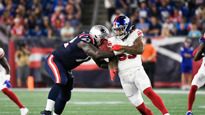 Aug 11, 2022; Foxborough, Massachusetts, USA; New England Patriots offensive tackle Yodny Cajuste (72) blocks New York Giants linebacker Oshane Ximines (53) during the first half of a preseason game at Gillette Stadium. Mandatory Credit: Eric Canha-Imagn Images
