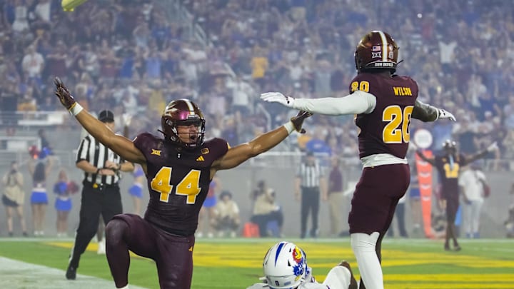 Oct 5, 2024; Tempe, Arizona, USA; Arizona State Sun Devils linebacker Keyshaun Elliott (44) and defensive back Kamari Wilson (20) celebrate a play against the Kansas Jayhawks at Mountain America Stadium. Mandatory Credit: Mark J. Rebilas-Imagn Images