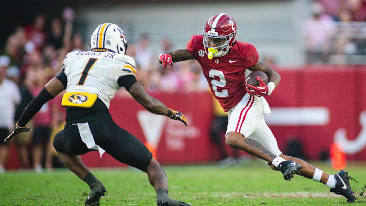 Oct 26, 2024; Tuscaloosa, Alabama, USA; Alabama Crimson Tide wide receiver Ryan Williams (2) runs the ball against Missouri Tigers safety Marvin Burks Jr. (1) during the fourth quarter at Bryant-Denny Stadium.