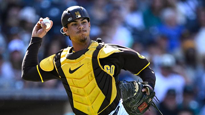 Mar 26, 2024; San Diego, California, USA; San Diego Padres catcher Ethan Salas throws to first base during the ninth inning against the Seattle Mariners at Petco Park. Mandatory Credit: Orlando Ramirez-USA TODAY Sports Mar 26, 2024; San Diego, California, USA; San Diego Padres catcher Ethan Salas throws to first base during the ninth inning against the Seattle Mariners at Petco Park. Mandatory Credit: Orlando Ramirez-USA TODAY Sports