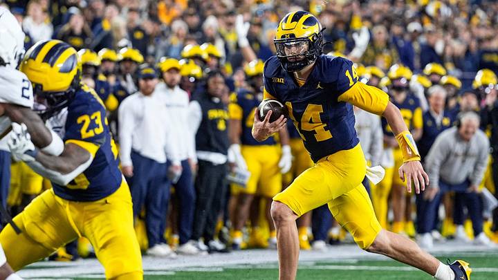 Michigan quarterback Tommy Carr (14) runs against Penn State during the second half at Michigan Stadium in Ann Arbor on Saturday, Oct. 17, 2026.
