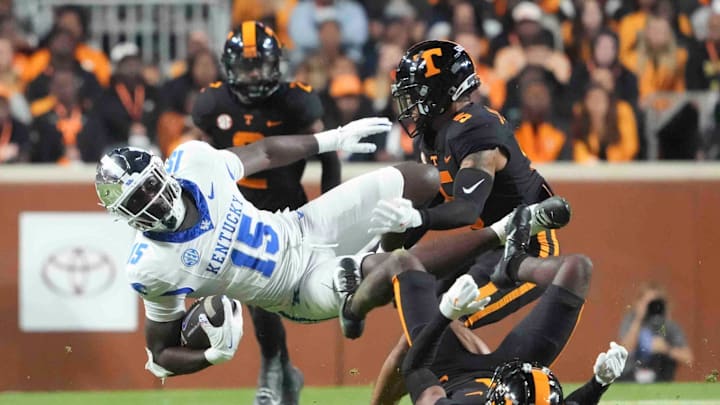 Kentucky tight end Khamari Anderson (15) is tackled by Tennessee defensive back Christian Harrison (5), during a game between Tennessee and Kentucky at Neyland Stadium in Knoxville, Tenn., Saturday, Nov. 2, 2024.