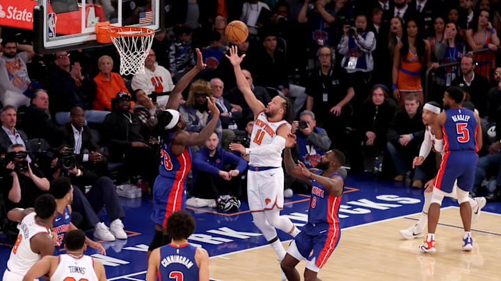 Jan 13, 2025; New York, New York, USA; New York Knicks guard Jalen Brunson (11) drives to the basket against Detroit Pistons center Isaiah Stewart (28) and forward Tim Hardaway Jr. (8) during the fourth quarter at Madison Square Garden. Mandatory Credit: Brad Penner-Imagn Images