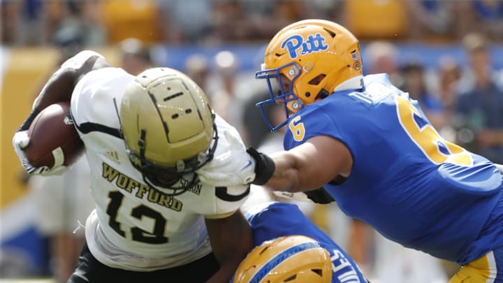Sep 2, 2023; Pittsburgh, Pennsylvania, USA; Pittsburgh Panthers defensive linemen Nate Temple (6) and Deandre Jules (0) tackle Wofford Terriers running back Ryan Ingram (12) in the backfield during the first quarter at Acrisure Stadium. Mandatory Credit: Charles LeClaire-Imagn Images Sep 2, 2023; Pittsburgh, Pennsylvania, USA; Pittsburgh Panthers defensive linemen Nate Temple (6) and Deandre Jules (0) tackle Wofford Terriers running back Ryan Ingram (12) in the backfield during the first quarter at Acrisure Stadium. Mandatory Credit: Charles LeClaire-Imagn Images
