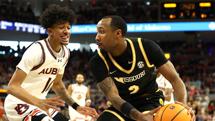 Jan 4, 2025; Auburn, Alabama, USA; Missouri Tigers guard Tamar Bates (2) is pressured by Auburn Tigers guard Chad Baker-Mazara (10) during the first half at Neville Arena. Mandatory Credit: John Reed-Imagn Images Jan 4, 2025; Auburn, Alabama, USA; Missouri Tigers guard Tamar Bates (2) is pressured by Auburn Tigers guard Chad Baker-Mazara (10) during the first half at Neville Arena. Mandatory Credit: John Reed-Imagn Images