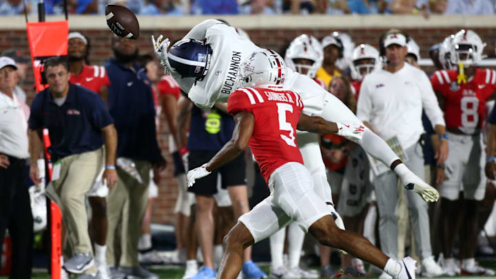 Sep 21, 2024; Oxford, Mississippi, USA; Georgia Southern Eagles wide receiver DeAndre Buchannon (15) drops the ball as Mississippi Rebels defensive back John Saunders Jr. (5) defends during the first half at Vaught-Hemingway Stadium. Mandatory Credit: Petre Thomas-Imagn Images