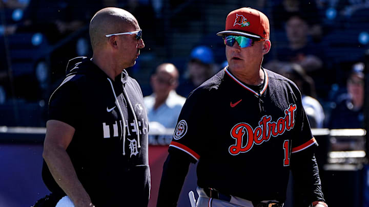 Detroit Tigers manager A.J. Hinch, right, talks to assistant athletic trainer Chris Macdonald.