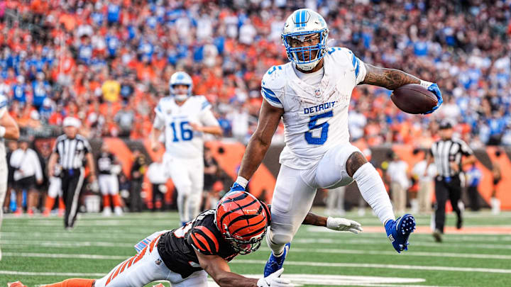 Detroit Lions running back David Montgomery (5) runs against Cincinnati Bengals cornerback DJ Turner II (20) during the second half at Paycor Stadium in Cincinnati on Sunday, Oct. 5, 2025.
