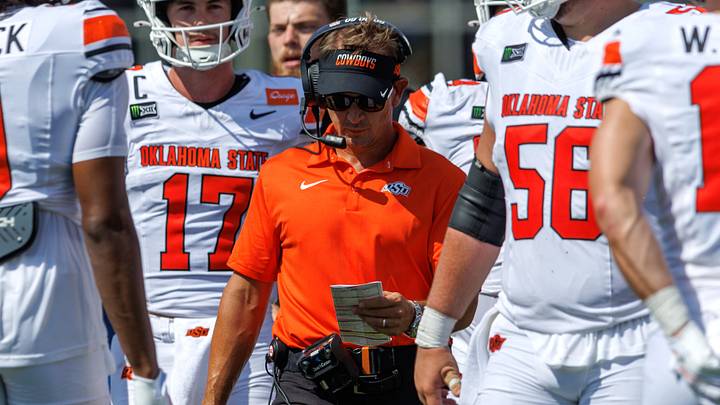 Sep 5, 2026; Tulsa, Oklahoma, USA; Oklahoma State Cowboys head coach Eric Morris walks on the field during a timeout during the first half against the Tulsa Golden Hurricane at Skelly Field at H.A. Chapman Stadium. Mandatory Credit: William Purnell-Imagn Images Sep 5, 2026; Tulsa, Oklahoma, USA; Oklahoma State Cowboys head coach Eric Morris walks on the field during a timeout during the first half against the Tulsa Golden Hurricane at Skelly Field at H.A. Chapman Stadium. Mandatory Credit: William Purnell-Imagn Images