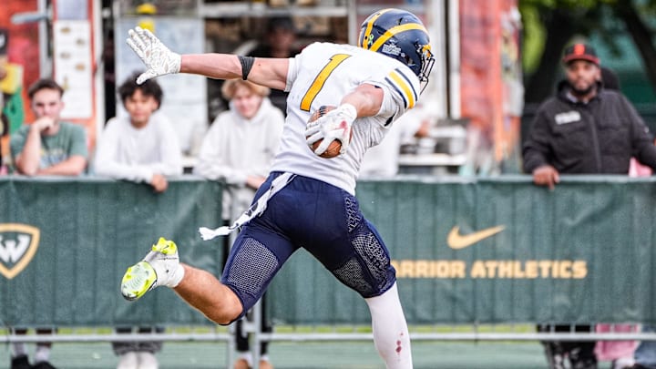 Clarkston running back Lucas Bowman (1) runs for a touchdown against Belleville during the second half of Prep Kickoff Classic at Wayne State University' Adams Field in Detroit on Thursday, August 28, 2025.