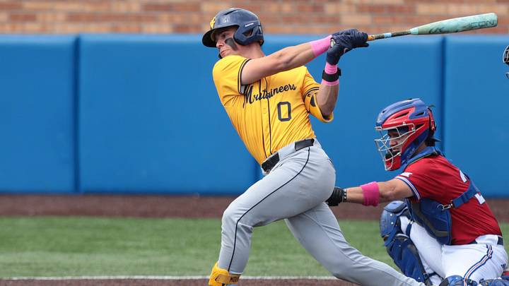 West Virginia Mountaineers senior Matthew Graveline (0) takes a swing off a Kansas Jayhawks pitch during the game inside Hoglund Ballpark on May 10, 2026.