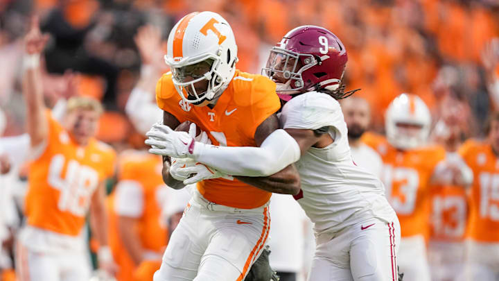 Tennessee wide receiver Dont'e Thornton Jr. (1) tries to escape a tackle by Alabama defensive back Jaylen Mbakwe (9) after making a catch during an SEC conference game between Tennessee and Alabama in Neyland Stadium on Saturday, Oct. 19, 2024.