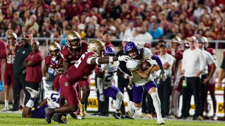 Nov 18, 2023; Tallahassee, Florida, USA; North Alabama Lions running back Parker Driggers (4) runs past Florida State Seminoles linebacker Omar Graham Jr. (36) during the first quarter at Doak S. Campbell Stadium. Mandatory Credit: Morgan Tencza-USA TODAY Sports