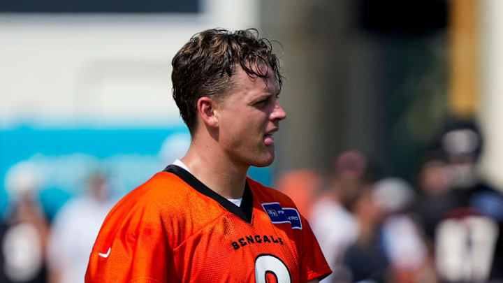 Cincinnati Bengals quarterback Joe Burrow (9) walks between stations during the second day of preseason training camp in downtown Cincinnati on Thursday, July 24, 2025. Cincinnati Bengals quarterback Joe Burrow (9) walks between stations during the second day of preseason training camp in downtown Cincinnati on Thursday, July 24, 2025.