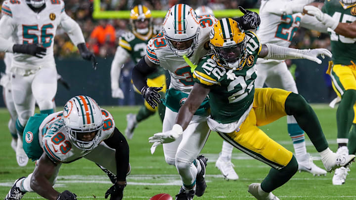Green Bay Packers cornerback Robert Rochell (22) dives on a muffed punt by Miami Dolphins wide receiver Malik Washington (83) on Thursday, November 28, 2024, at Lambeau Field in Green Bay, Wis. The Packers won the game, 30-17. Green Bay Packers cornerback Robert Rochell (22) dives on a muffed punt by Miami Dolphins wide receiver Malik Washington (83) on Thursday, November 28, 2024, at Lambeau Field in Green Bay, Wis. The Packers won the game, 30-17.
