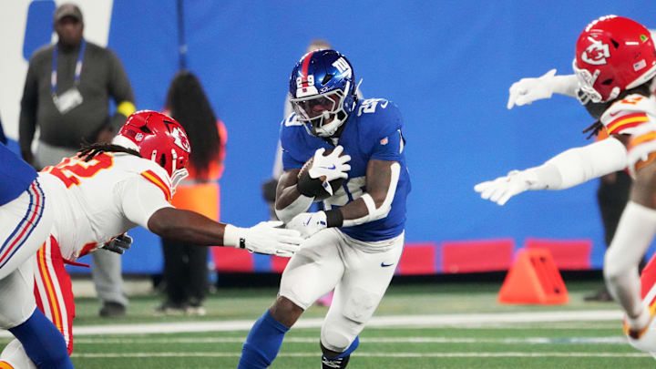 Sep 21, 2025; East Rutherford, New Jersey, USA; New York Giants running back Tyrone Tracy Jr. (29) runs against Kansas City Chiefs linebacker Nick Bolton (32) in the first quarter at MetLife Stadium. Sep 21, 2025; East Rutherford, New Jersey, USA; New York Giants running back Tyrone Tracy Jr. (29) runs against Kansas City Chiefs linebacker Nick Bolton (32) in the first quarter at MetLife Stadium.