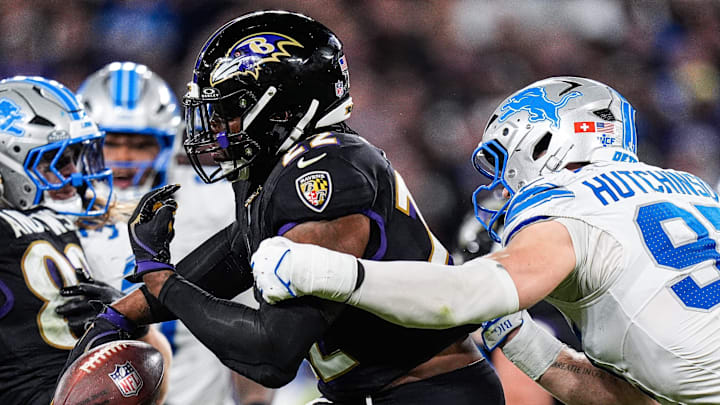 Detroit Lions defensive end Aidan Hutchinson (97) forces Baltimore Ravens running back Derrick Henry (22) to fumble during the second half at M&T Bank Stadium in Baltimore, Md. on Monday, Sept. 22, 2025.