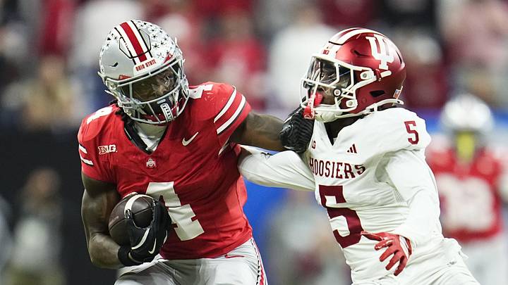 Ohio State Buckeyes wide receiver Jeremiah Smith (4) shakes off Indiana Hoosiers defensive back D'Angelo Ponds (5) during the Big Ten Conference championship game at Lucas Oil Stadium in Indianapolis on Dec. 6, 2025. Ohio State lost 13-10. Ohio State Buckeyes wide receiver Jeremiah Smith (4) shakes off Indiana Hoosiers defensive back D'Angelo Ponds (5) during the Big Ten Conference championship game at Lucas Oil Stadium in Indianapolis on Dec. 6, 2025. Ohio State lost 13-10.