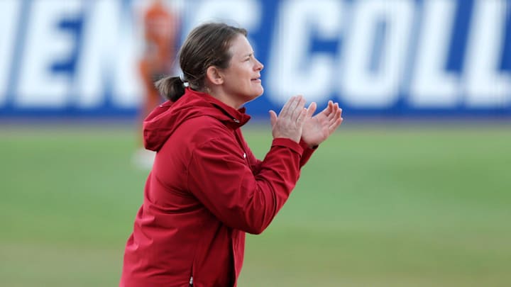 Stanford coach Jessica Allister cheers for her team during a Women's College World Series softball game between the Texas Longhorns and the Stanford Cardinal at Devon Park in Oklahoma City, Thursday, May 30, 2024. Texas won 4-0.